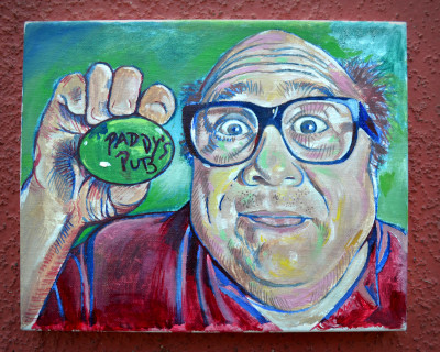 Danny Devito holding a paddy's pub egg.